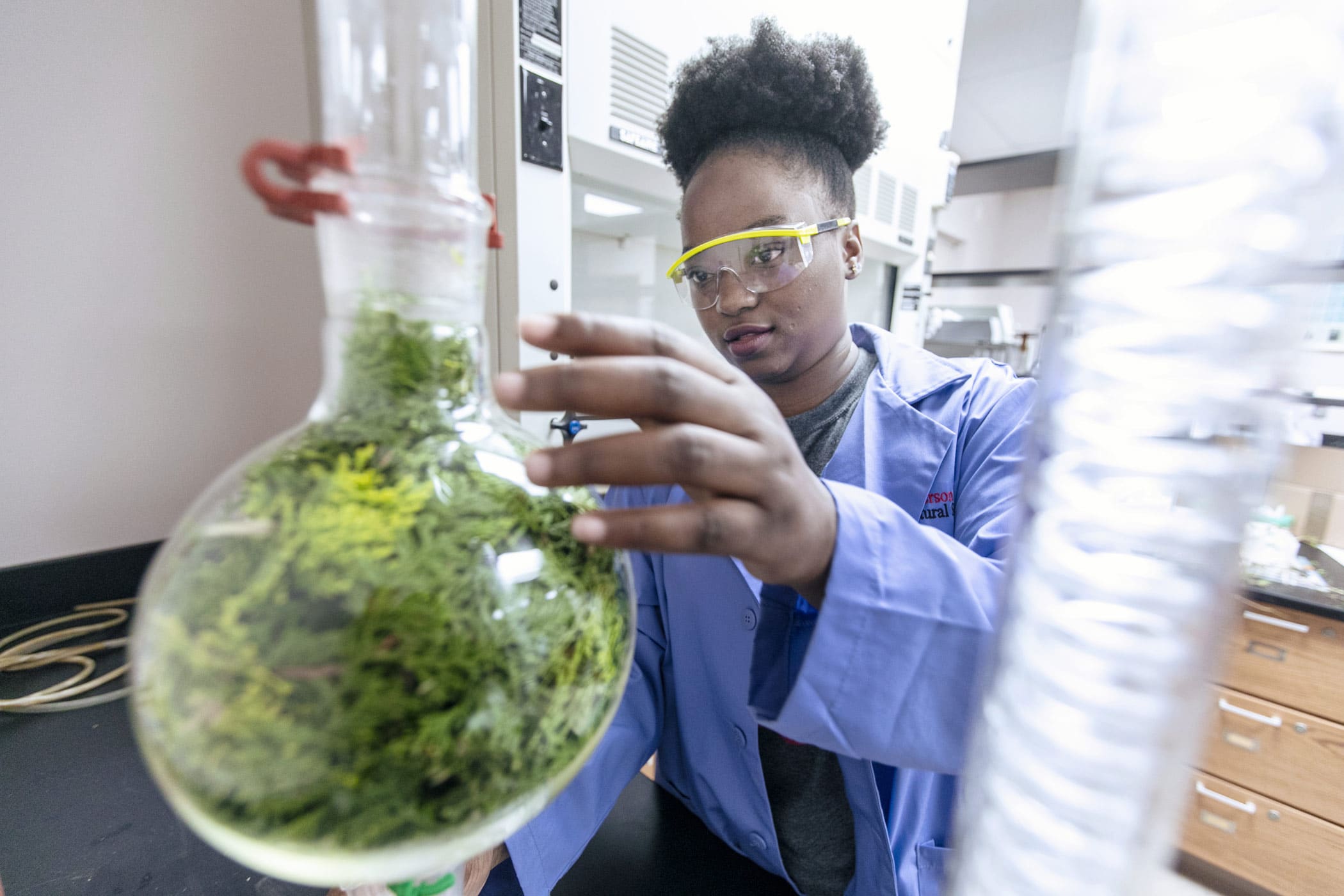 McPherson College student studying in a lab.